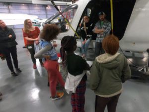 Youth asking questions about Beta's prototype plane.