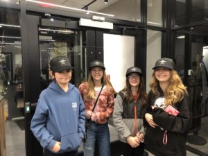 Youth wearing Beta Technologies hats.
